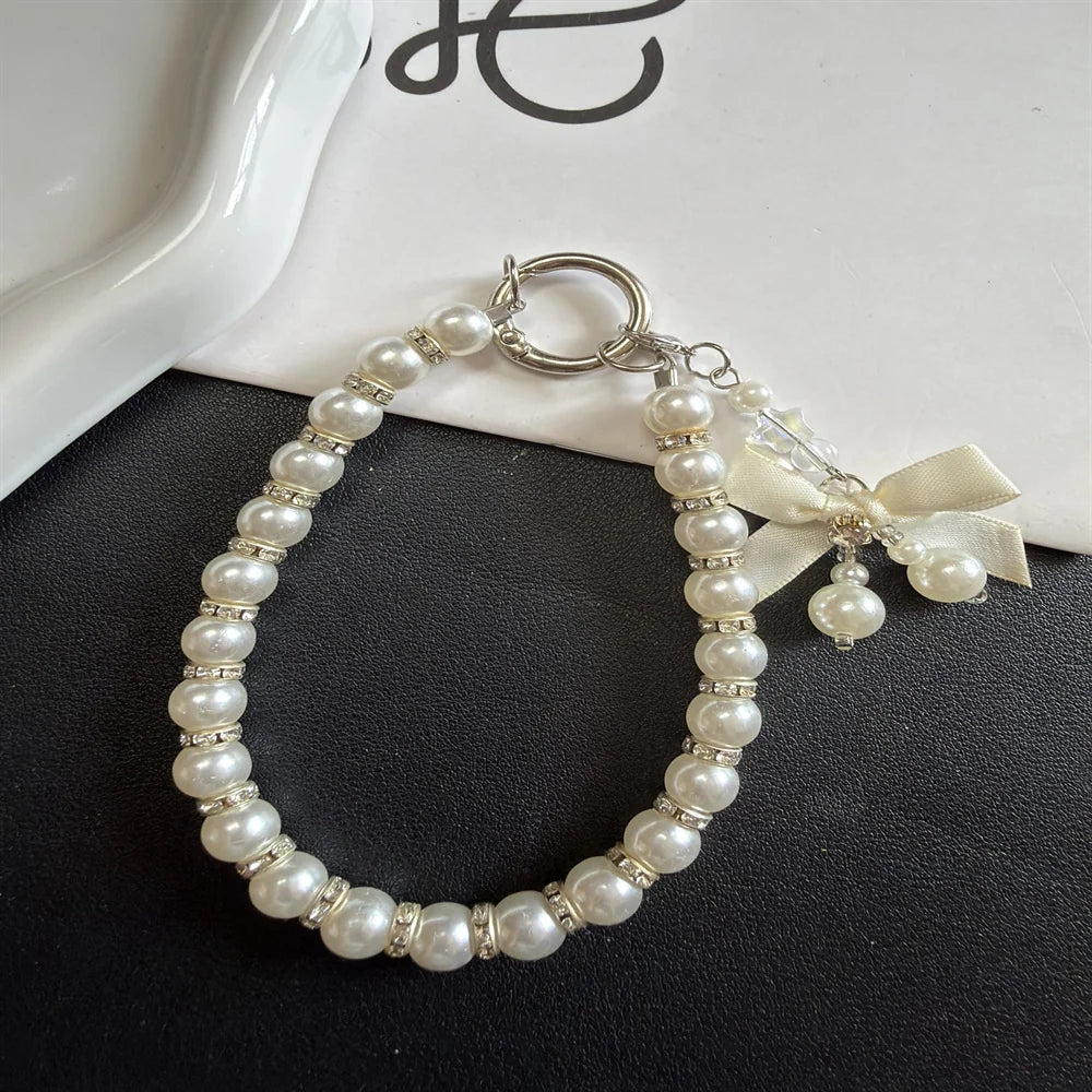 Dames Sleutelhanger Met Parelversiering En Strikdetail 2