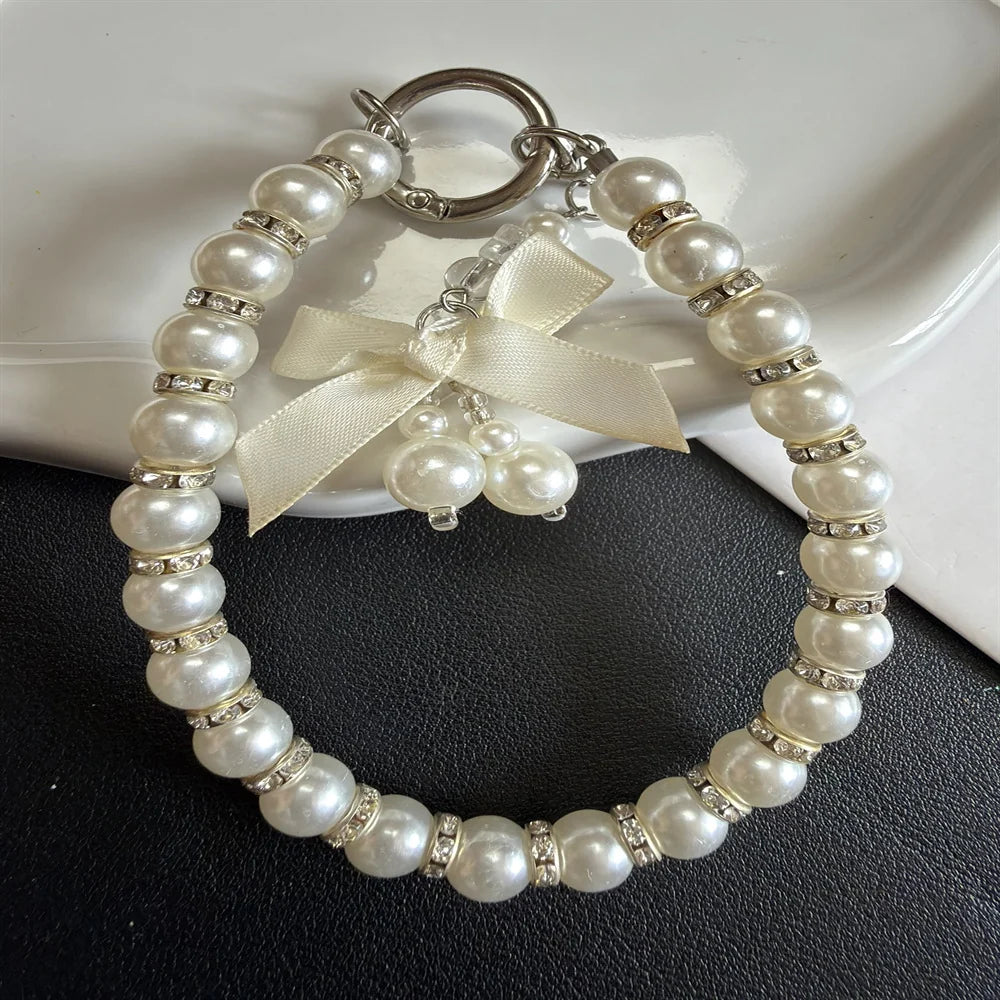 Dames Sleutelhanger Met Parelversiering En Strikdetail 3