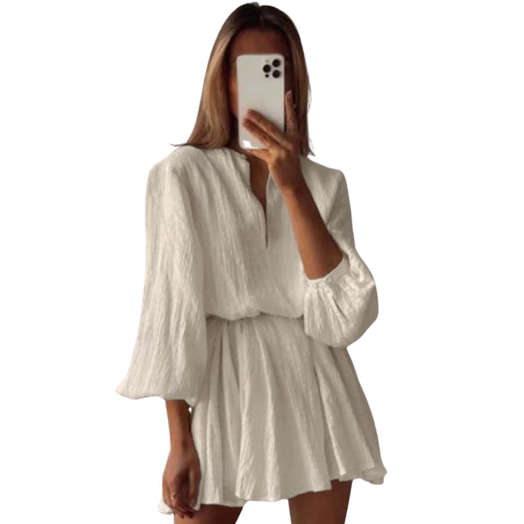 Damesjurk met strikceintuur en korte ballonmouwen